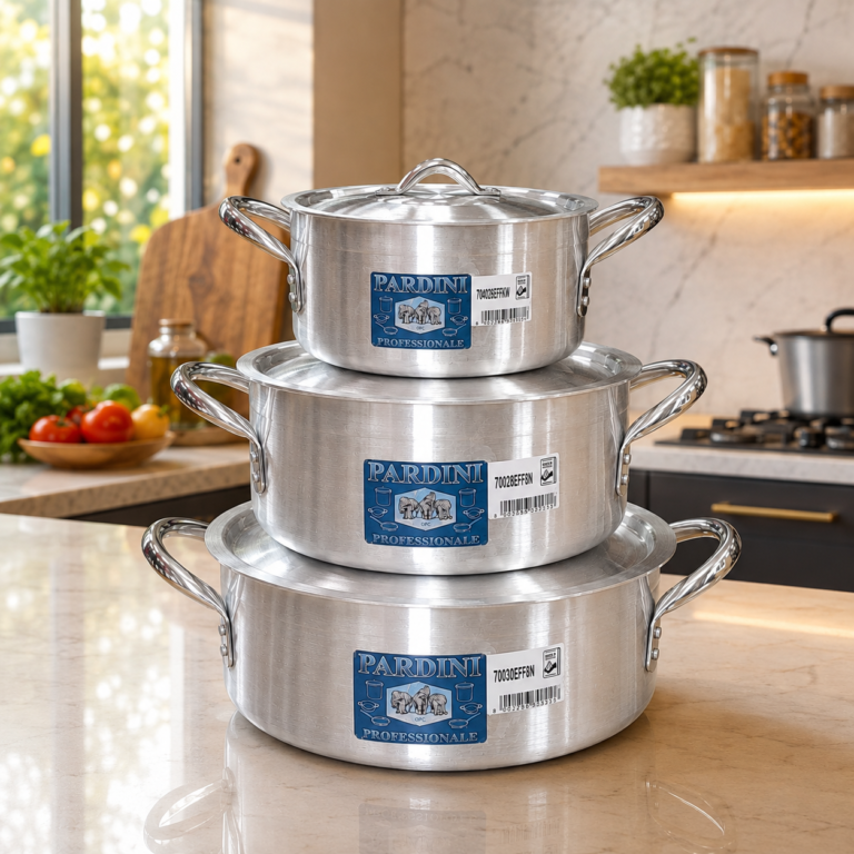 Stack of 3 Pardini professional medium height aluminium casserole sufurias with lids manufactured by Kaluworks on a kitchen counter