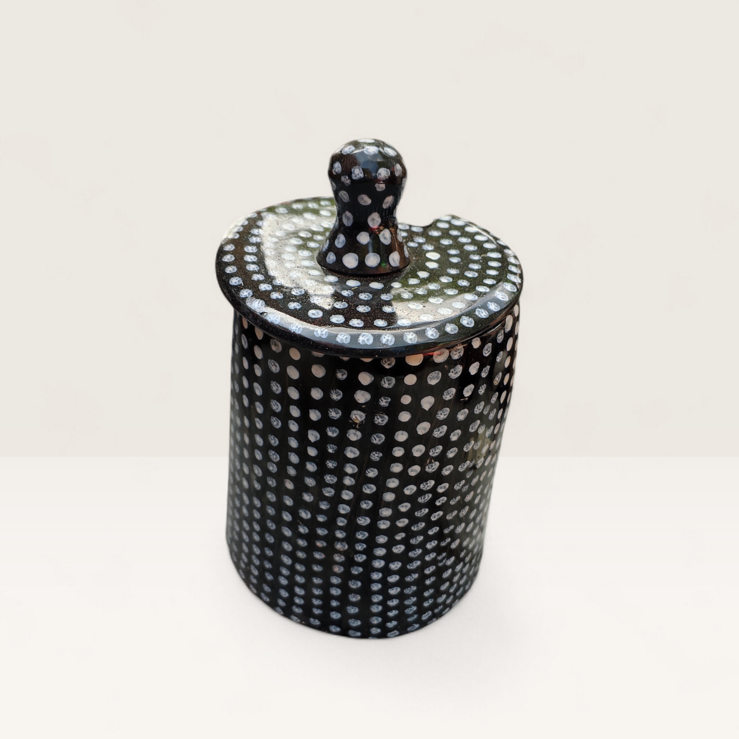 Handcrafted black and white polka dot batik pattern Kenyan cow horn sugar bowl with fitted lid and horn spoon, made in Kenya.