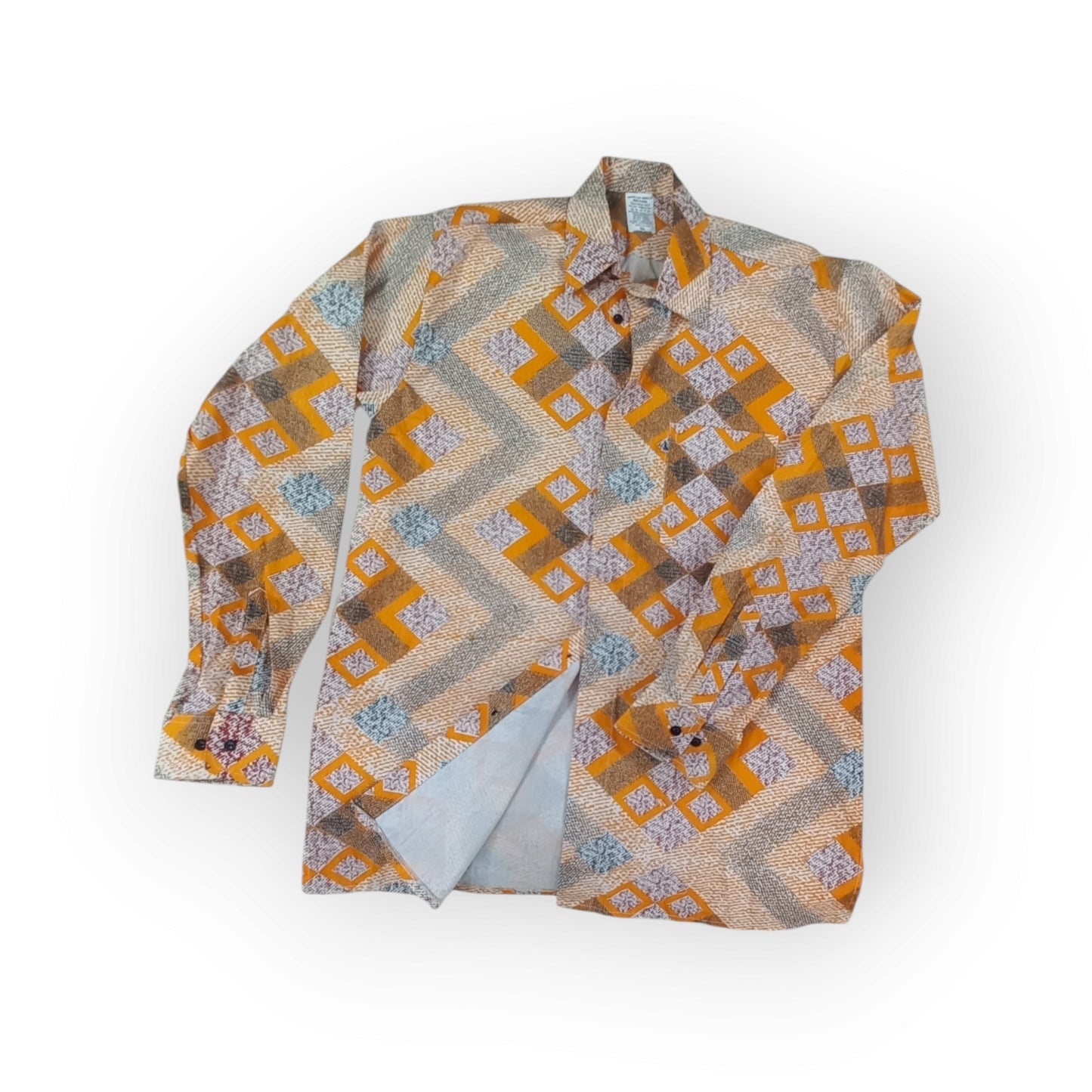 Made in Kenya Rivatex Presidential shirt with a bold orange, white, and black varied geometric print, ideal for a distinctive, modern look