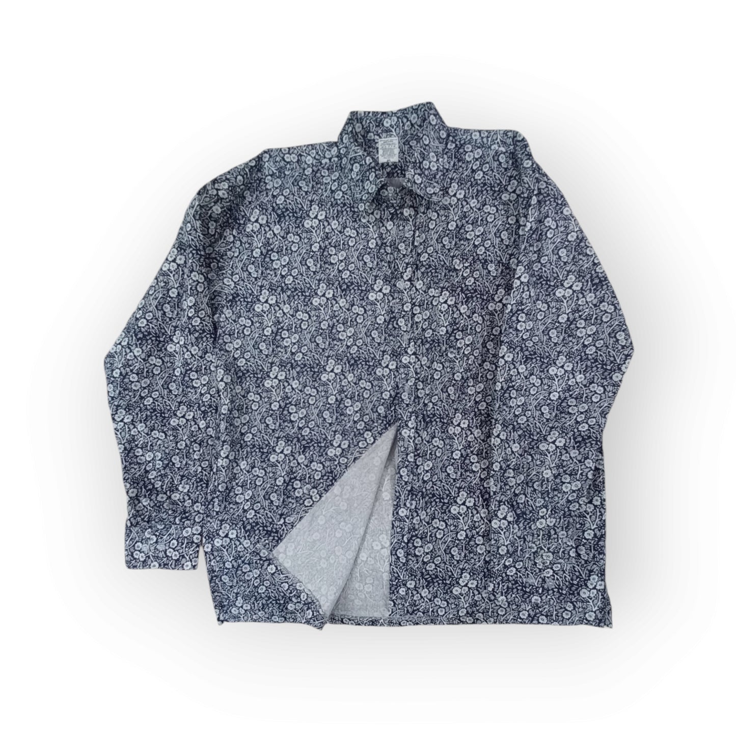 Men's Rivatex Uhuru shirt, Made in Kenya. Long sleeve navy blue cotton shirt with white floral botanical pattern.
