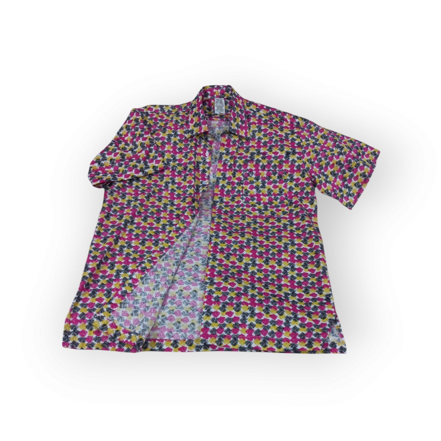 Men's Rivatex Uhuru shirt, Made in Kenya. Short sleeve cotton shirt with vibrant pink, yellow, and black abstract geometric pattern.