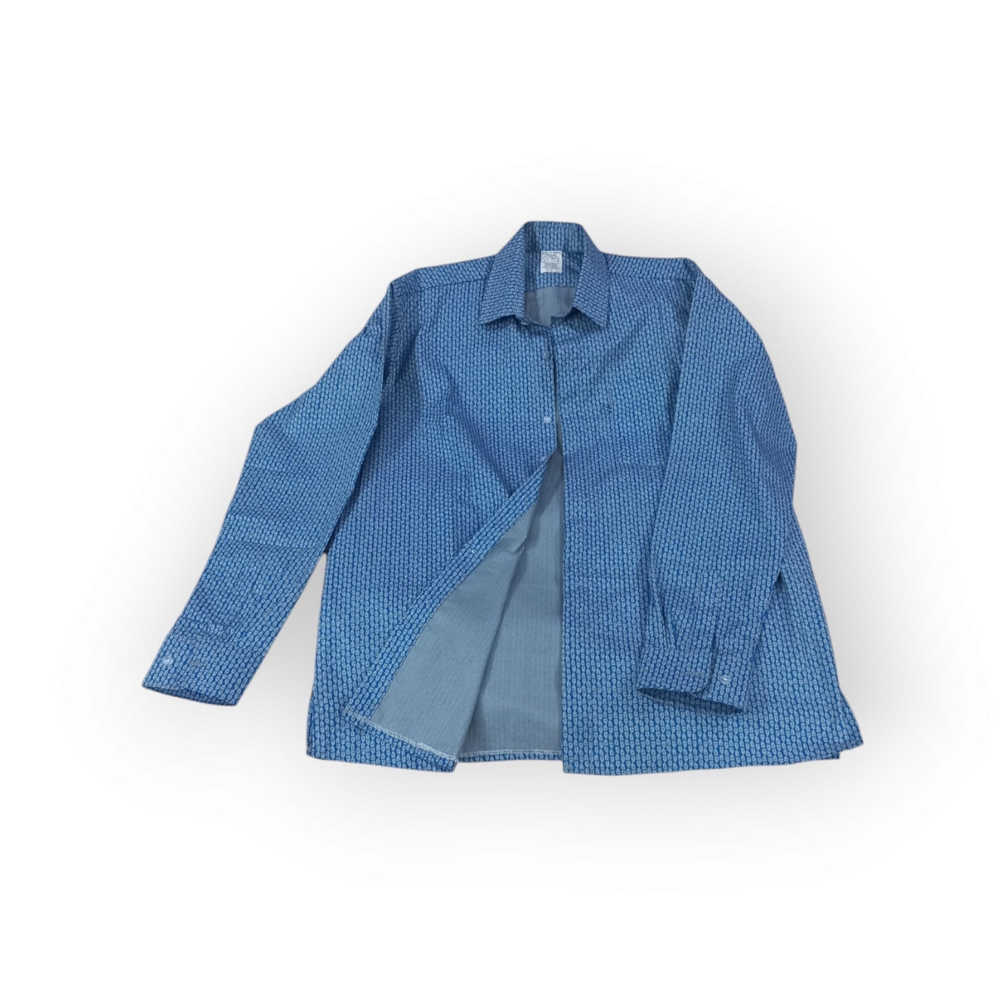 Blue long-sleeved men's button-down shirt with a repeating white geometric Asanoha pattern, lying flat on a white background. The shirt is slightly open, revealing a lighter blue underside.
