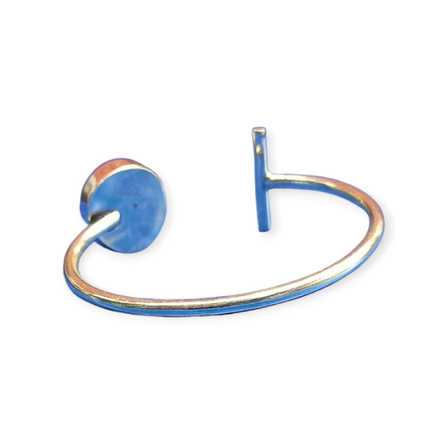 Artistic open brass bracelet with an organic swirled stone and a contemporary bar element