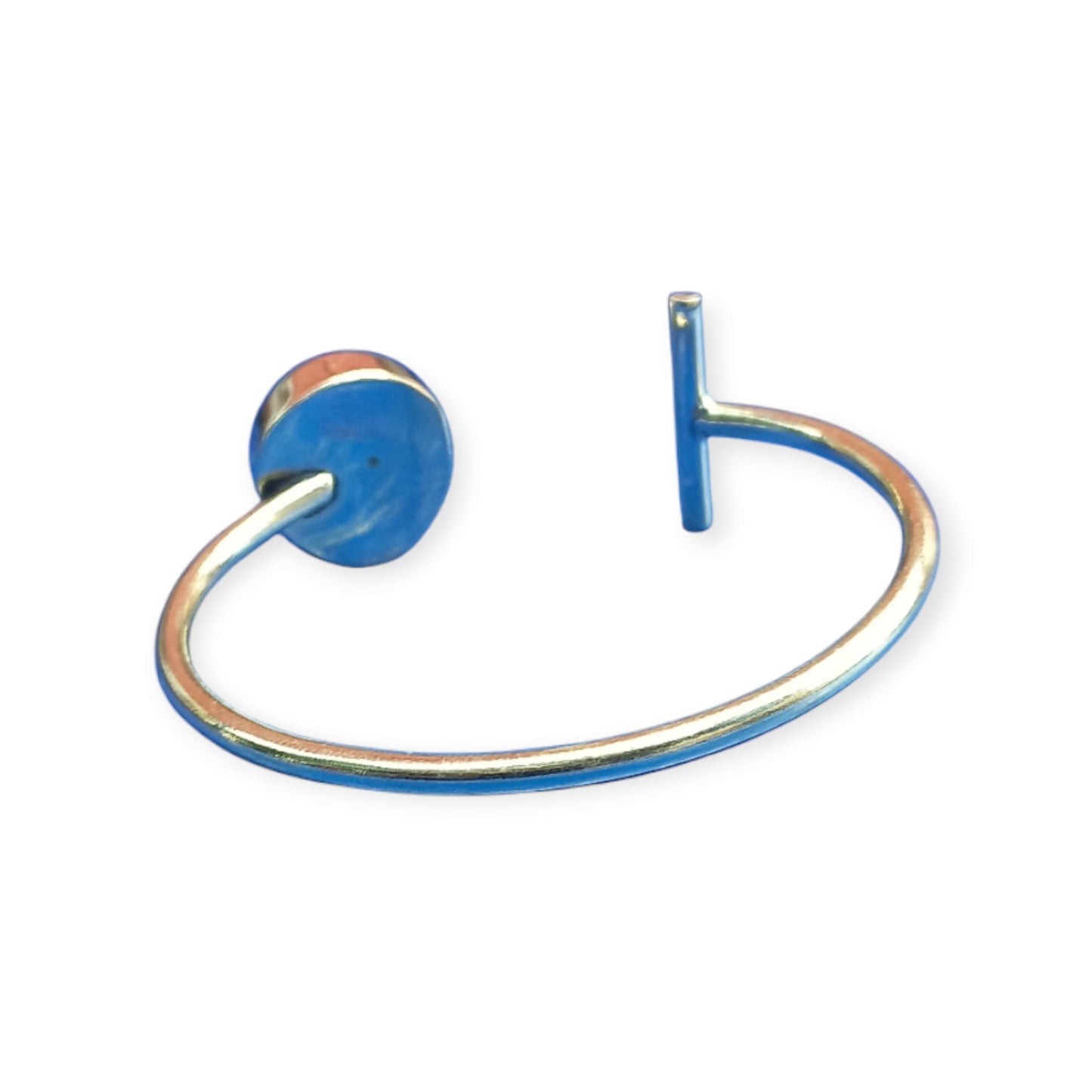 Handcrafted brass open cuff bracelet featuring a unique design with a circular patterned stone and a rectangular metal bar