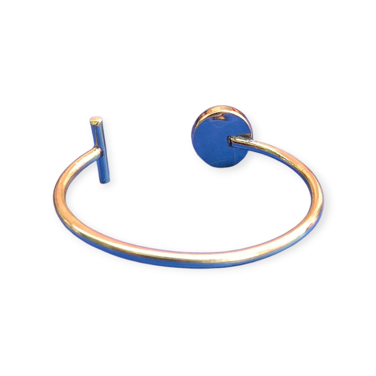 Handcrafted Kenyan brass open cuff bracelet featuring a unique design with a circular amethyst-like patterned stone and a rectangular metal bar.