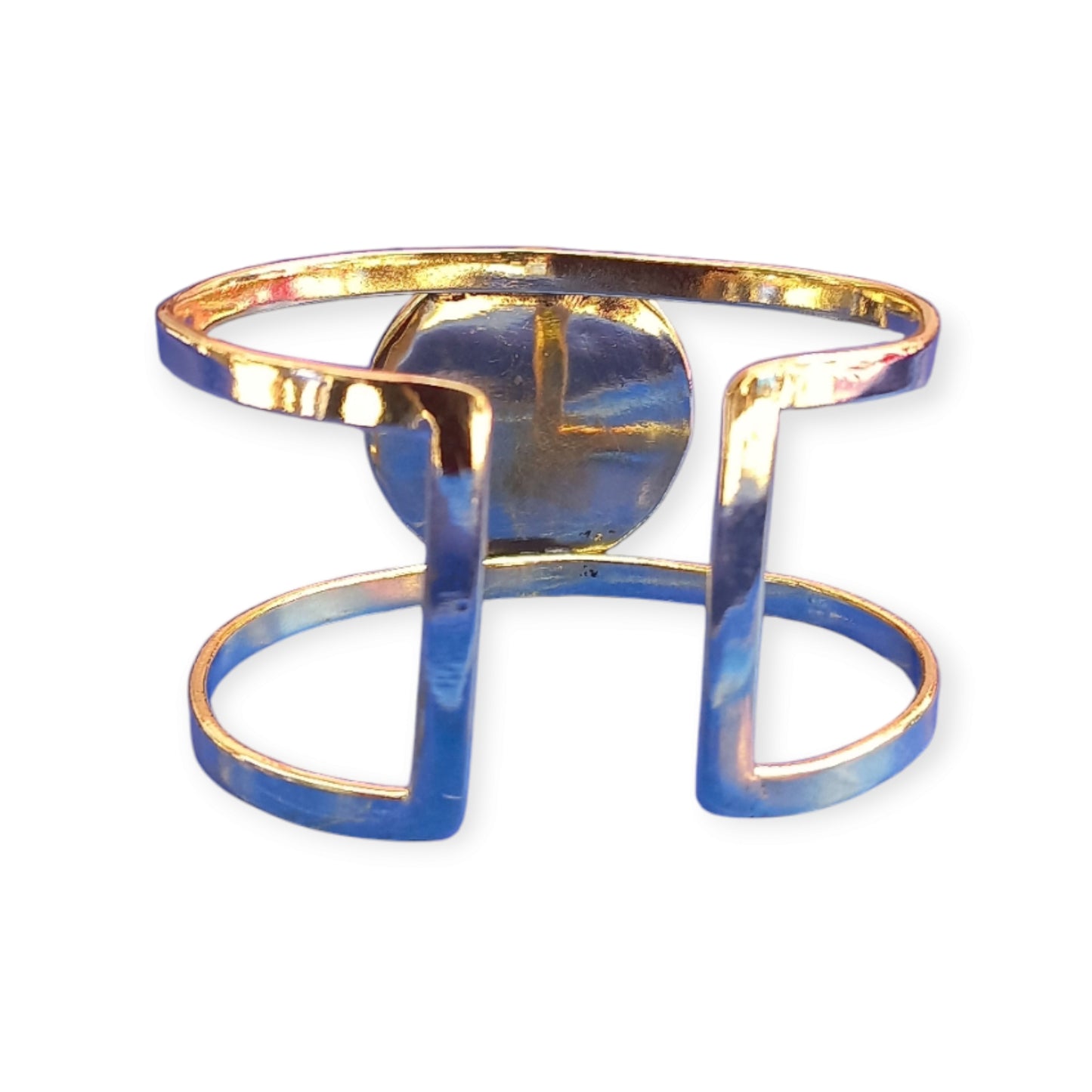 A handcrafted, adjustable brass bracelet from Kenya, designed as a double open cuff and featuring a striking, large black amber ornament.