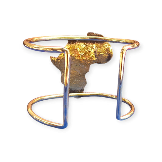 Kenyan-made brass bangle with a prominent, patinated map of Africa design at its center.