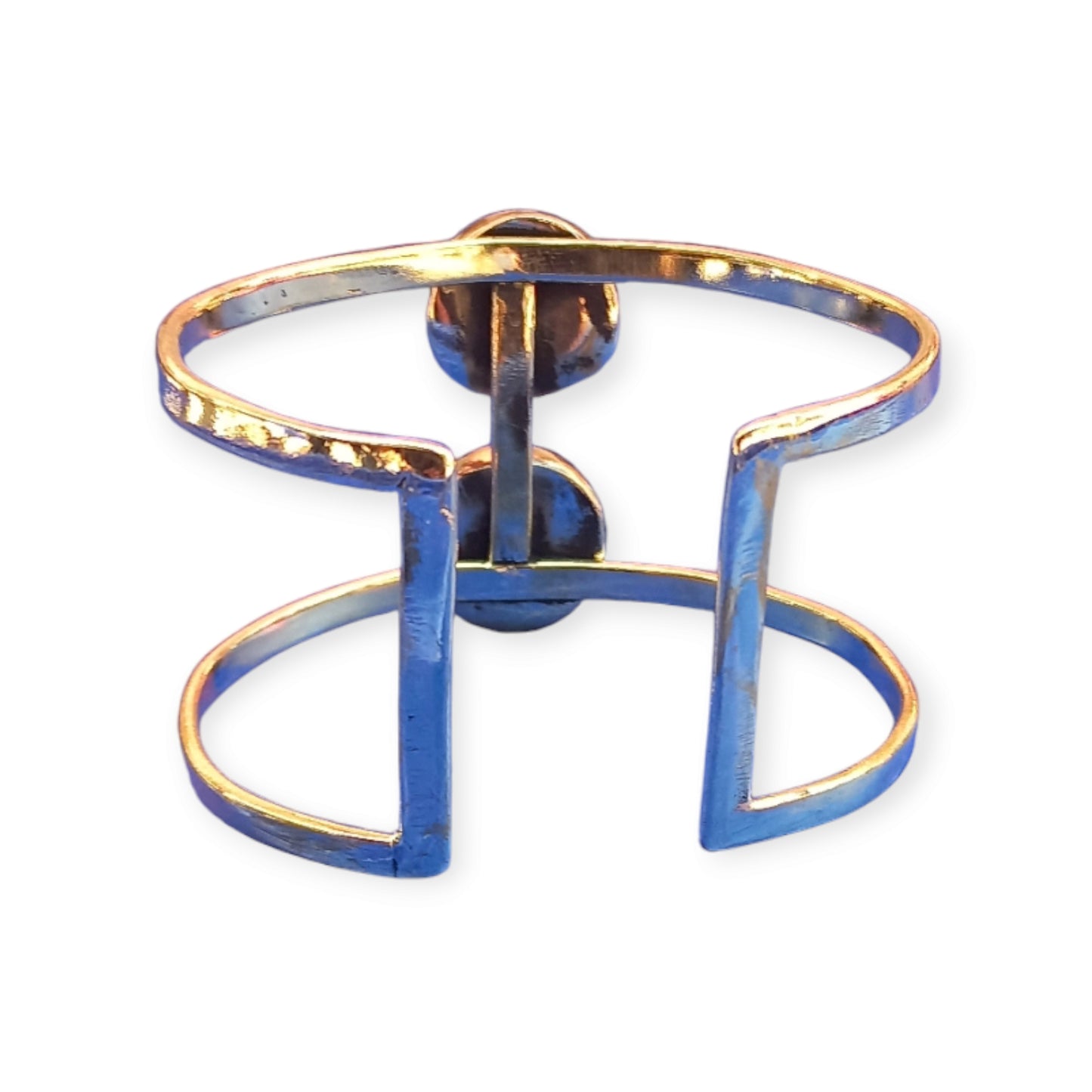 Adjustable open cuff bracelet made of polished brass from Kenya, showcasing two prominent, round honey-toned amber gemstones.