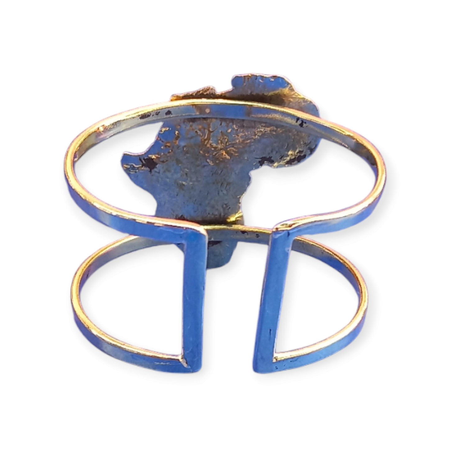 Handcrafted Kenyan brass cuff bracelet featuring a detailed silhouette of the African continent and a genuine cowrie shell.