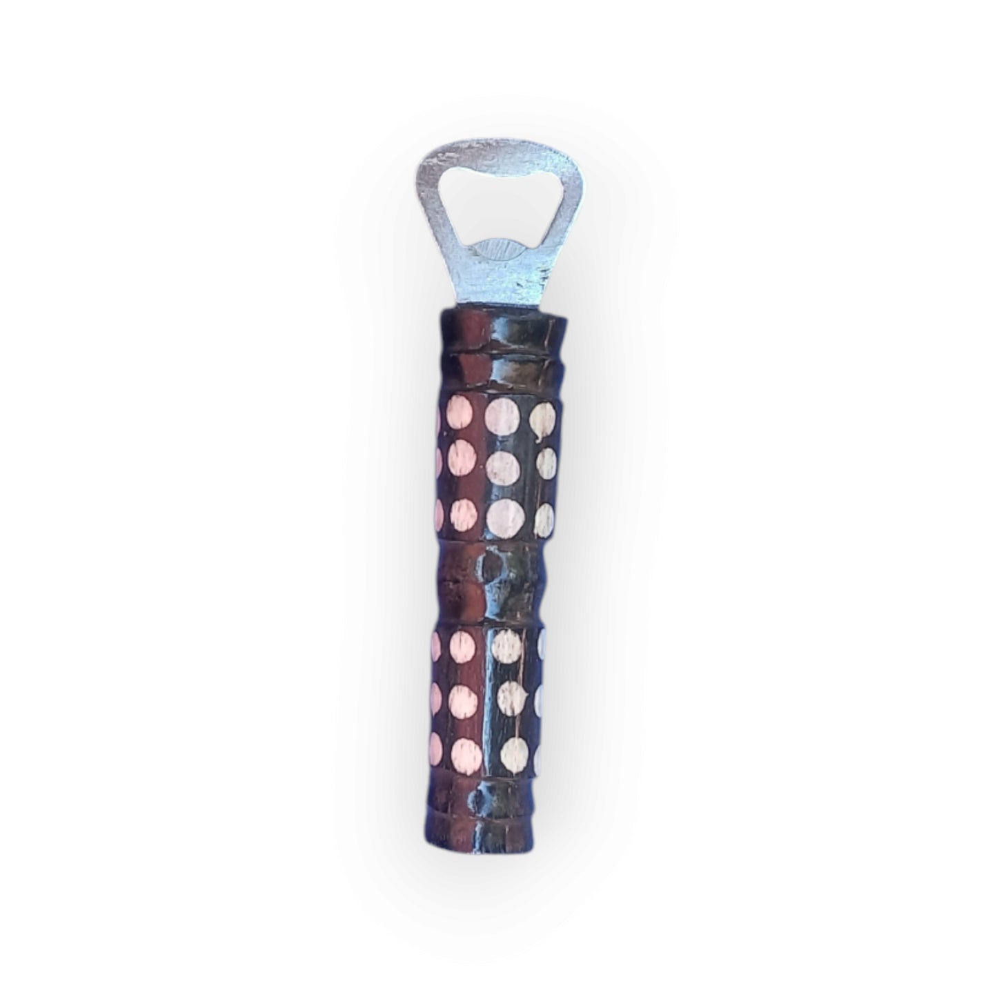 Kenyan handcrafted bone bottle opener with unique polka dot design.