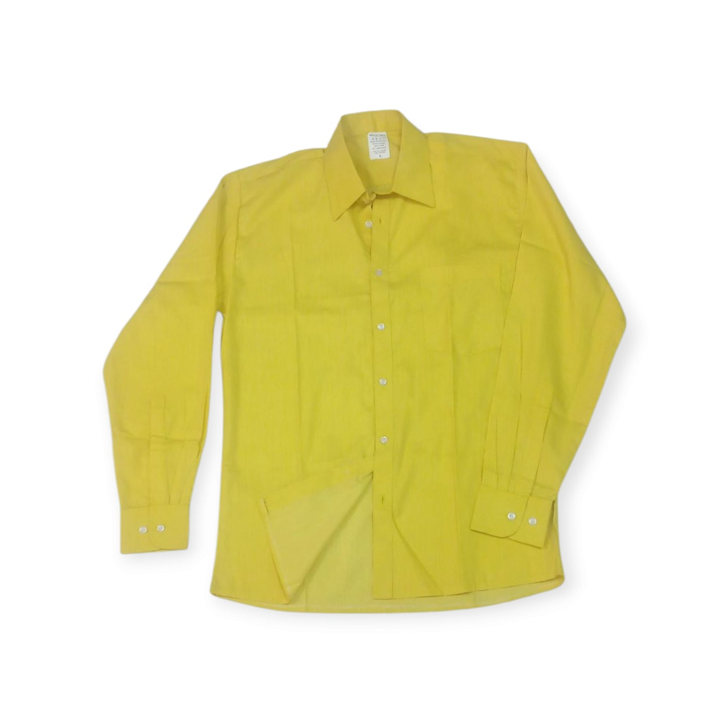 Kenyan textile artistry: the 'Uhuru' shirt by Rivatex, a bold yellow cotton button-down shirt.