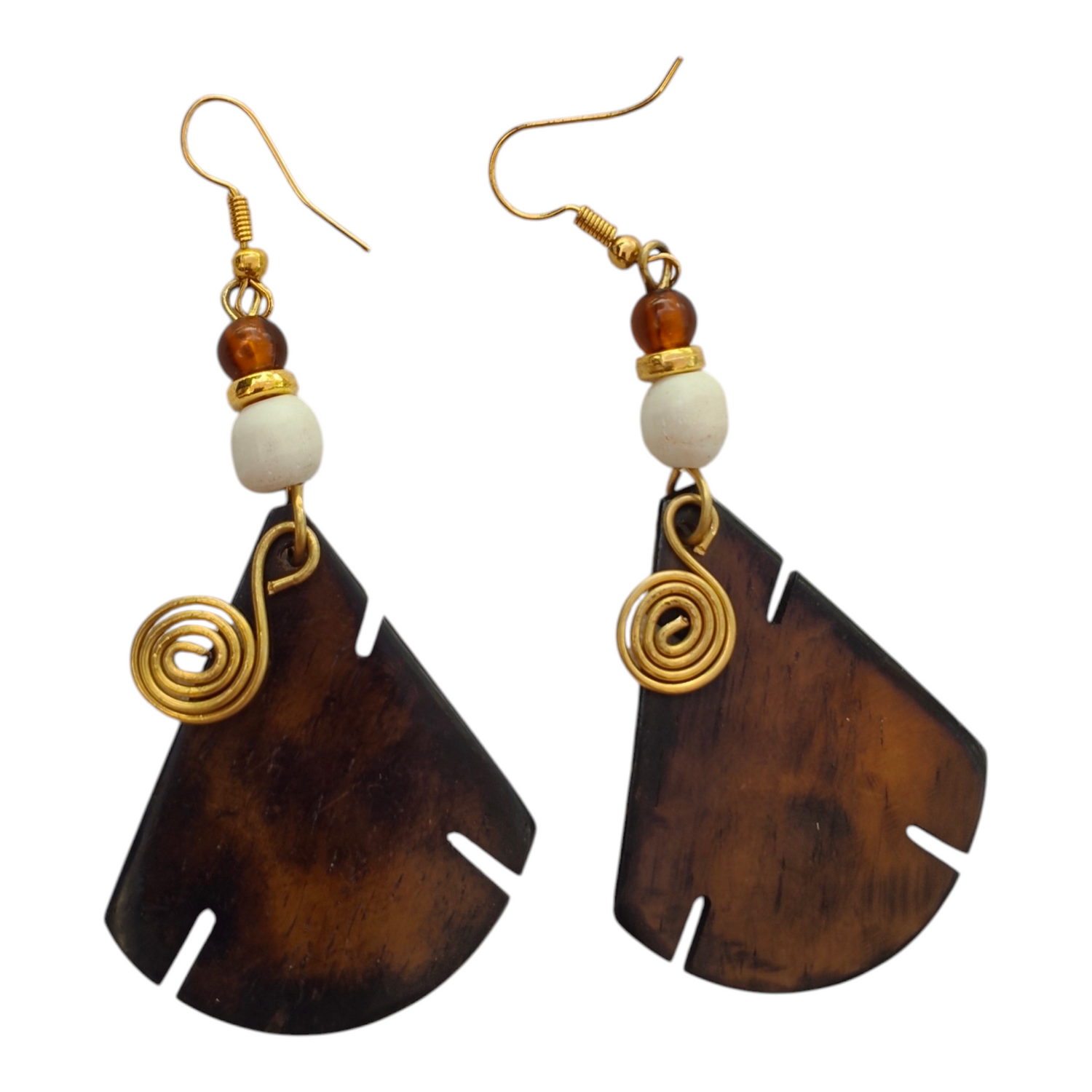 NuaLocal hand-carved dark brown upcycled bone leaf drop earrings with brass wire coil spiral, white bone bead, and amber glass bead accents, made in Kibera, Nairobi, Kenya.