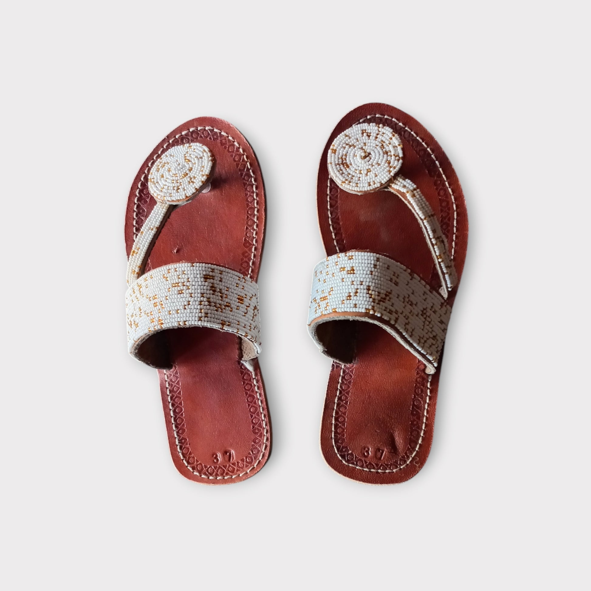 a pair of leather toe-ring maasai sandals. handamade in Kenya 