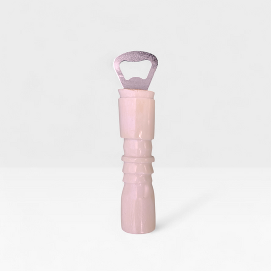 Handcrafted plain cow bone bottle opener with carved handle ridges made by Kibera artisans in Kenya