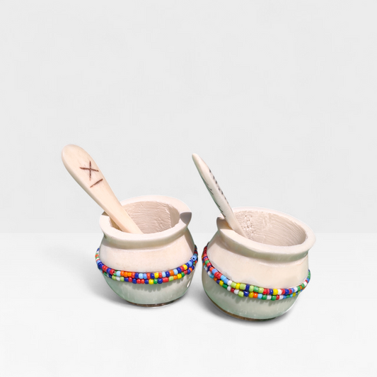 Handcrafted set of 2 cream bone spice pots with colorful Maasai bead bands and mini bone spoons, made in Kibera Nairobi Kenya.