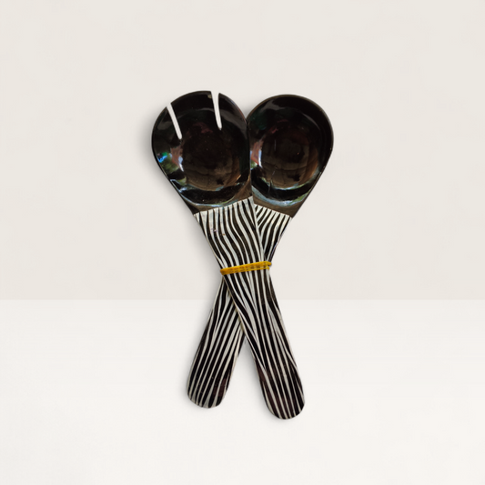 Handcrafted 2-piece set of Kenyan cow horn salad servers with black horn heads and zebra stripe batik handles, made in Kenya.