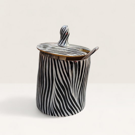 Handcrafted zebra batik pattern Kenyan cow horn sugar bowl with fitted lid and small horn spoon, made in Kenya.