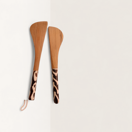Handcrafted set of 2 Kenyan olive wood butter spreader knives with animal print batik bone handles and hanging loop, made in Ukambani Kenya.