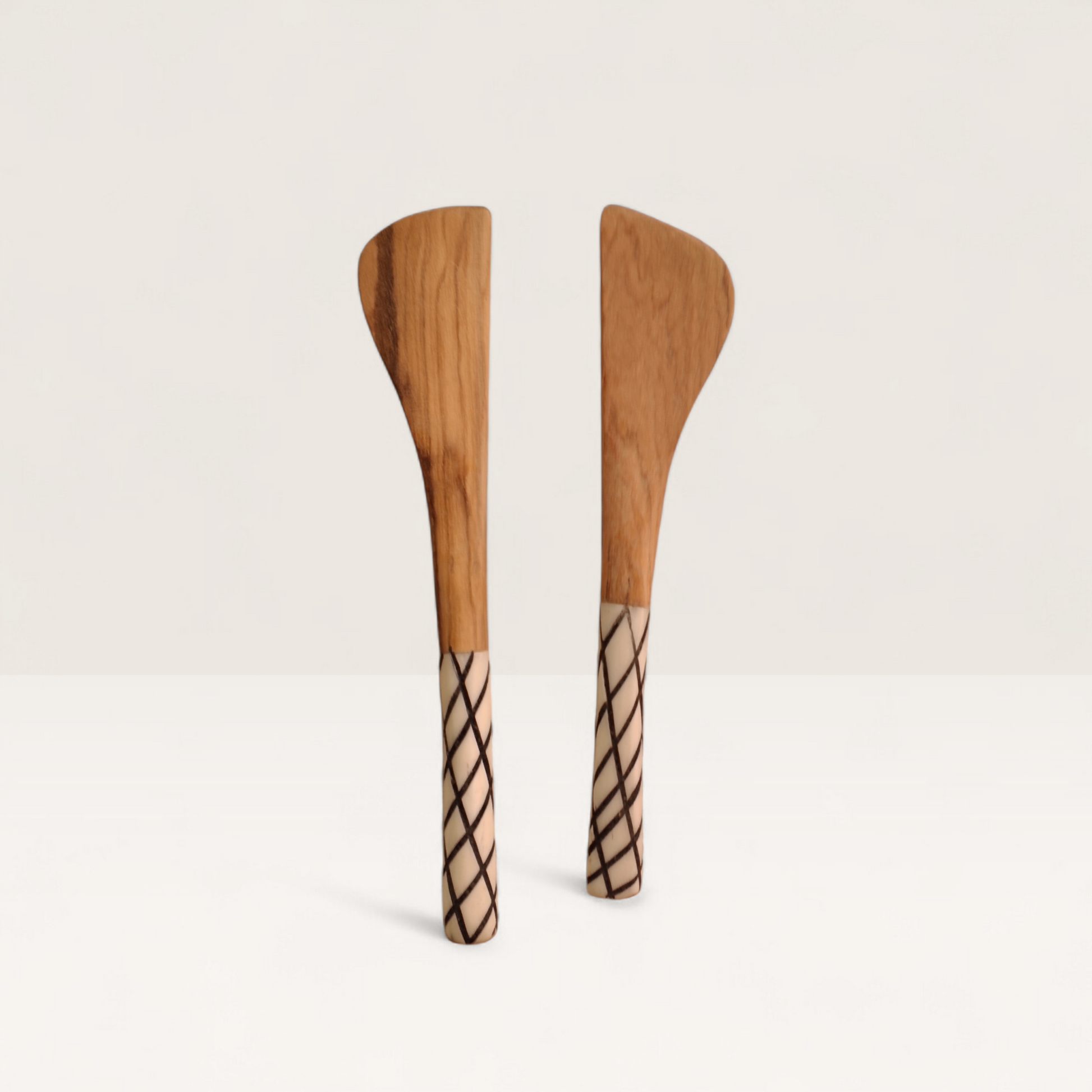 Handcrafted set of 2 Kenyan olive wood butter spreader knives with crosshatch lattice bone handles, made in Ukambani Kenya.