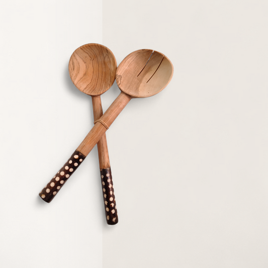 Handcrafted 2-piece Kenyan olive wood salad serving spoons with dark polka dot batik bone handles, made in Ukambani Kenya.