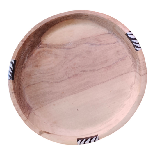 Handcrafted 12-inch round Kenyan olive wood shallow serving platter with zebra stripe batik bone inlay rim, made in Ukambani Kenya.