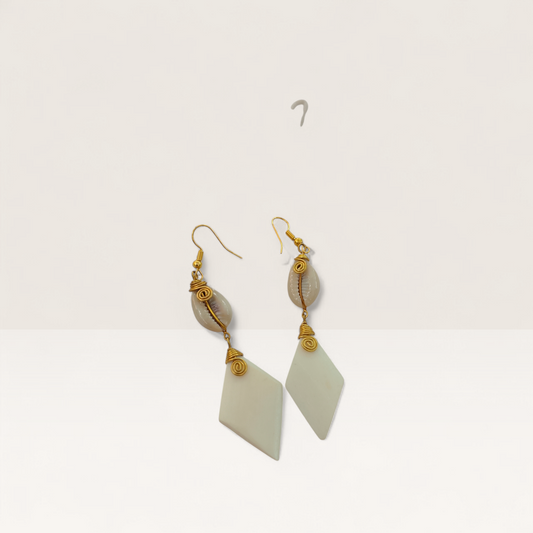 Handcrafted Kenyan drop earrings featuring white diamond-shaped bone, natural cowrie shells, and gold brass wire-wrap detailing