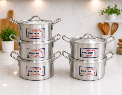 King Lion 5 piece chrome hi casserole polished aluminium sufuria set 3L 4L 5L 7L 9L with lids arranged on a white marble kitchen counter 