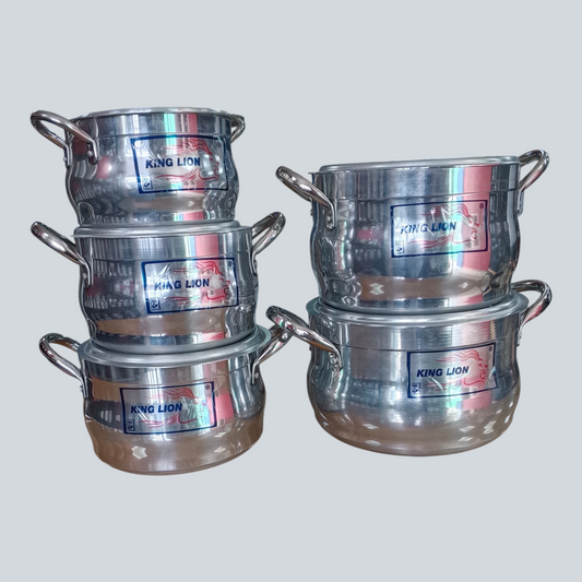 King Lion 5 piece polished aluminium diamond belly casserole sufuria set stacked in two piles on a wooden store counter manufactured by Kaluworks