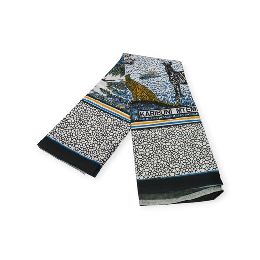 Celebrate the beauty of Kenya with this pair of Rivatex cotton lesos featuring a safari scene and a warm welcome.

