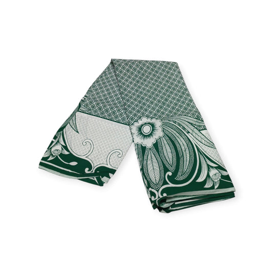 Two green cotton lesos made in Kenya, showcasing a beautiful green floral design on a white background.

