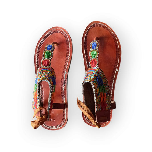 Pair of Maasai leather sandals with colorful beadwork

