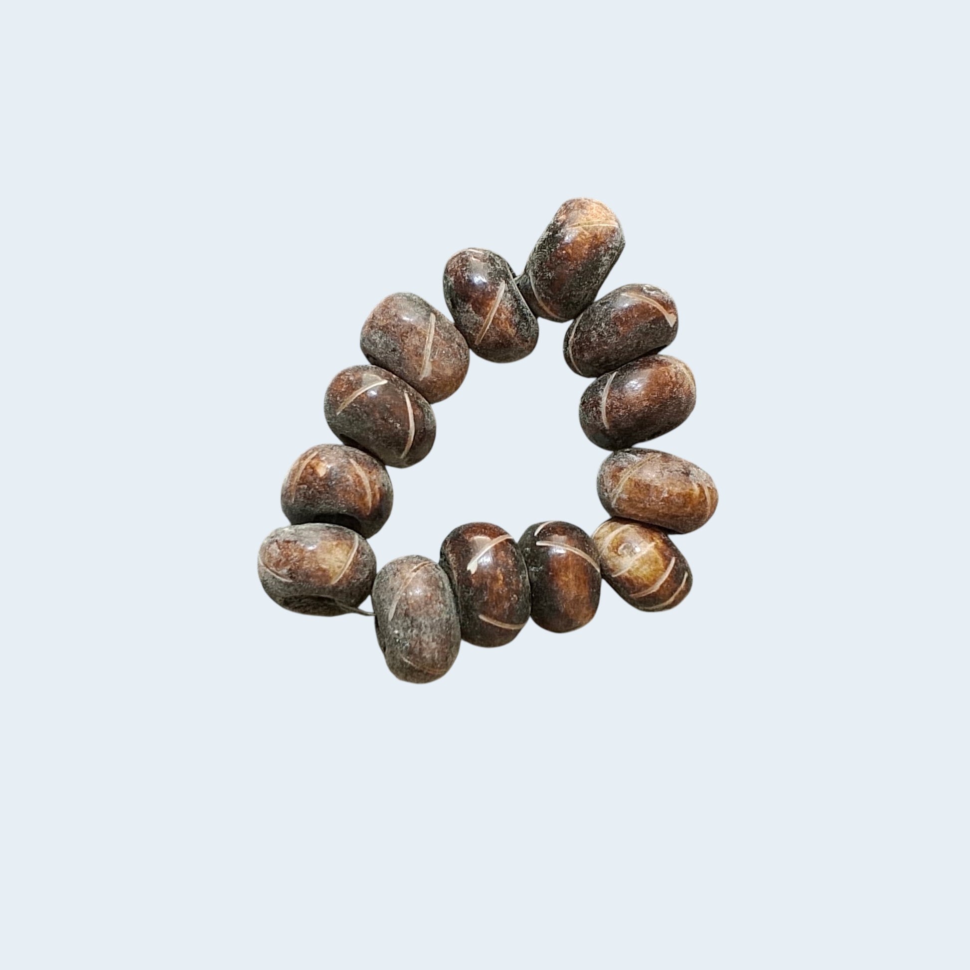 Nualocal hand-carved dark mahogany bone beads with rustic off-white cross-etched details for jewelry making