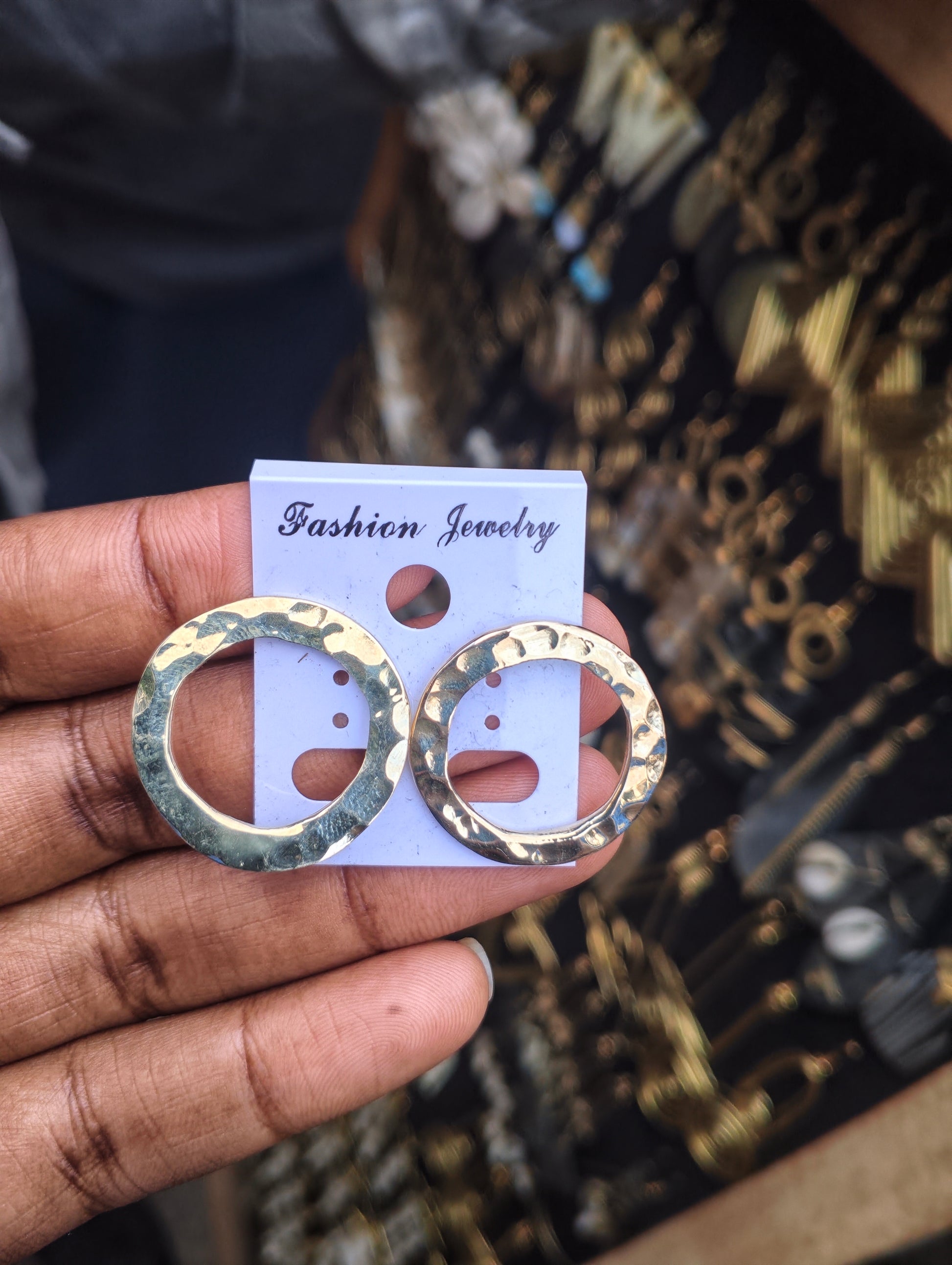 Handcrafted open circle brass hoop earrings with textured hammered finish, artisan made in Kibera Nairobi Kenya