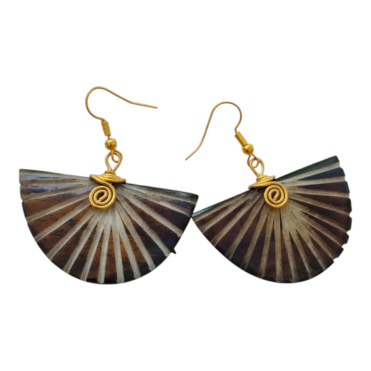 NuaLocal handcrafted dark brown and cream batik sunburst half-moon fan bone drop earrings with hand-coiled brass wire spiral, made in Kibera, Nairobi, Kenya.