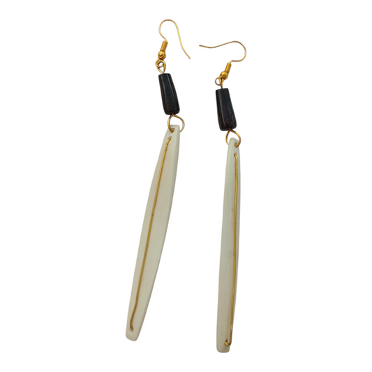 NuaLocal handcrafted off-white bone needle drop earrings with inline gold-tone brass wire inlay and dark accent bead, made in Kibera, Nairobi, Kenya.