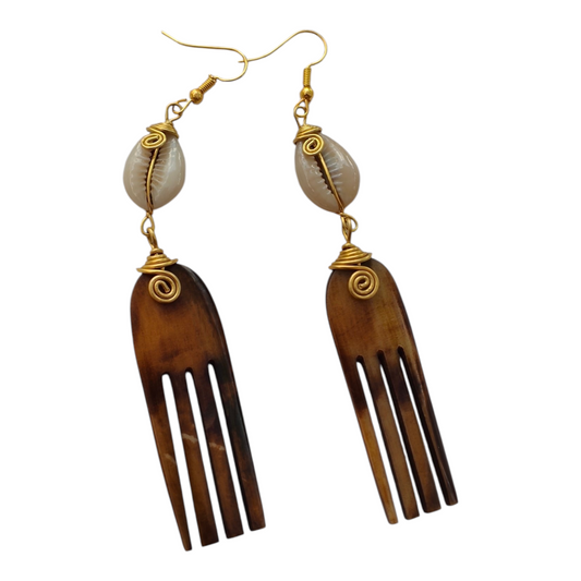 NuaLocal handcrafted dark brown batik-dyed upcycled bone Afro pick comb drop earrings with wire-wrapped brass coils and natural cowrie shells, made in Kibera, Nairobi, Kenya.