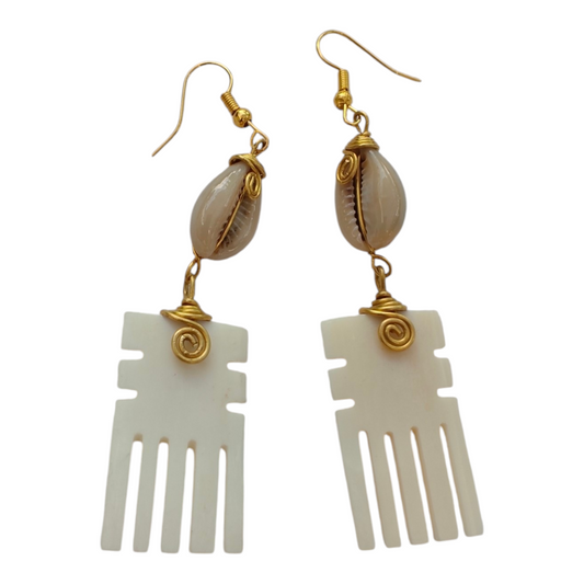 NuaLocal handcrafted natural off-white upcycled bone Afro pick comb drop earrings with geometric side notches, wire-wrapped brass coils, and natural cowrie shells, made in Kibera, Nairobi, Kenya.