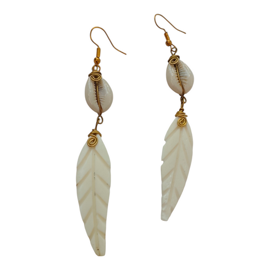 NuaLocal hand-carved off-white bone feather drop earrings with wire-wrapped natural cowrie shells and brass wire coils, made in Kibera, Nairobi, Kenya.