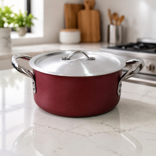 Nualocal Kaluworks maroon non-stick aluminium casserole sufuria with stainless steel handles and lid on a kitchen counter