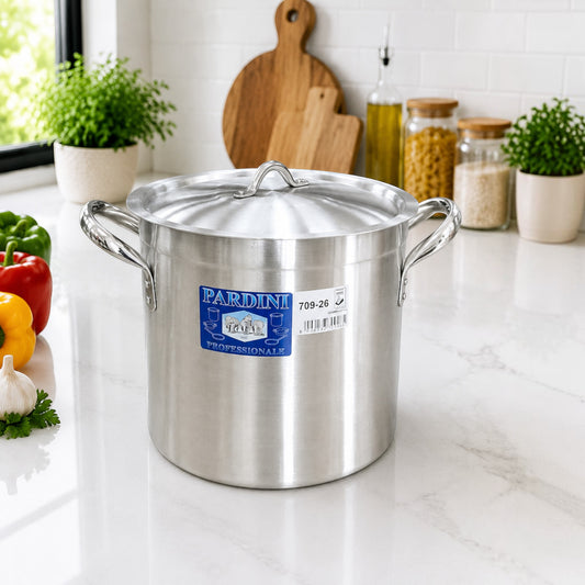 Nualocal Pardini Professionale polished aluminium stockpot with lid and riveted handles on a kitchen counter.