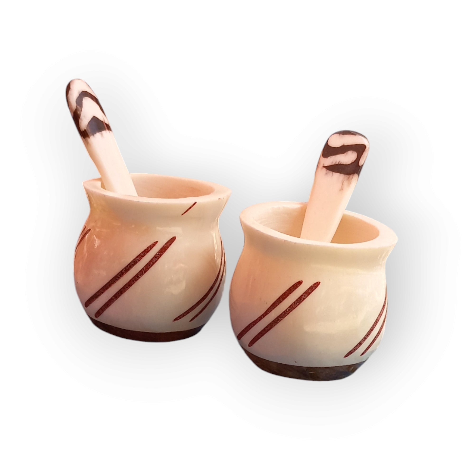 a pair of white stripped spice pots made of bone with a wooden base. handmade in Kenya 