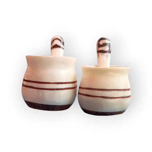 a pair of white stripped bone spice pots 