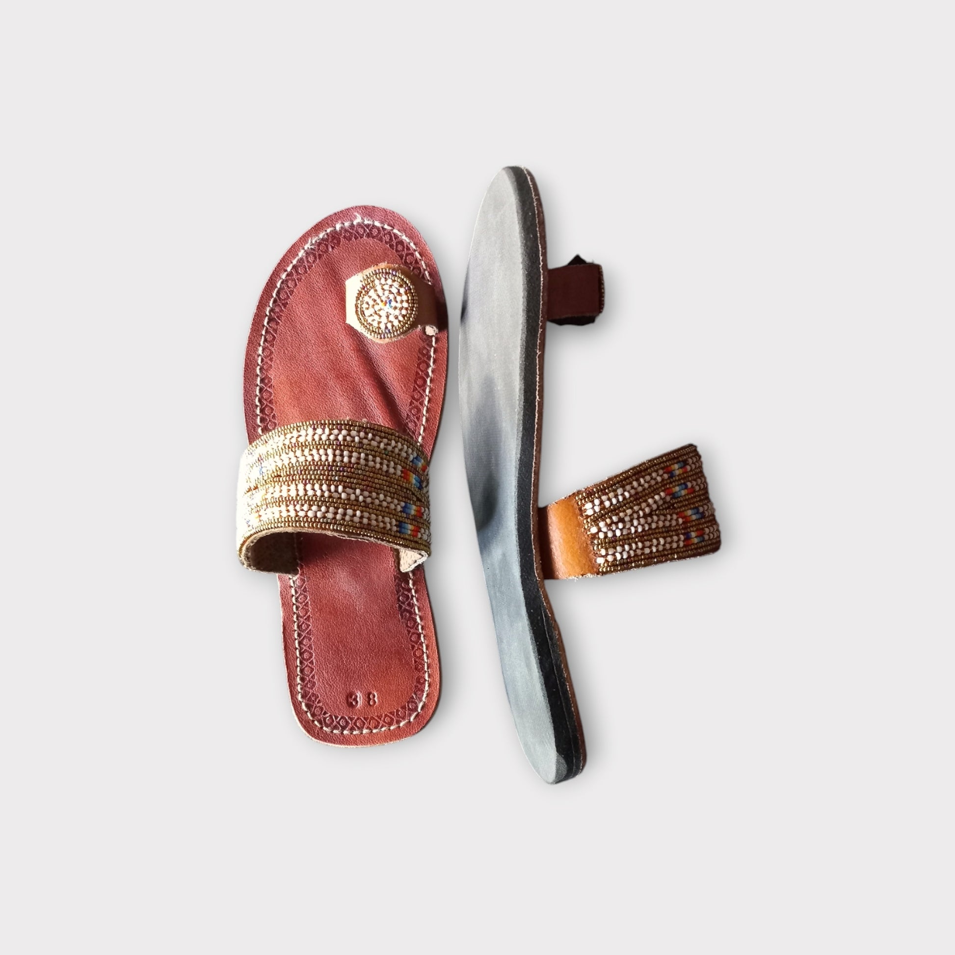 a air of brown beaded leather sandals 