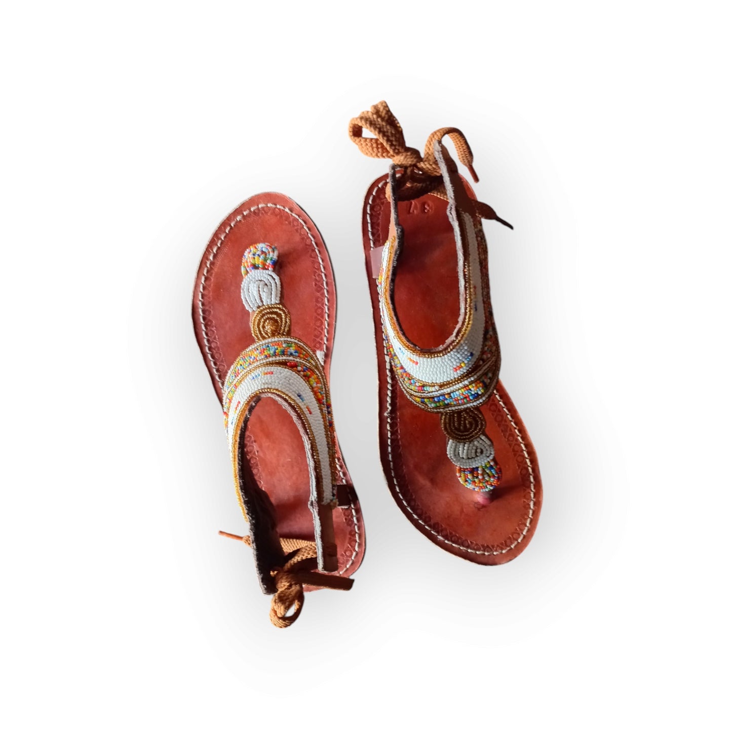 Pair of Maasai leather sandals with colorful beadwork
