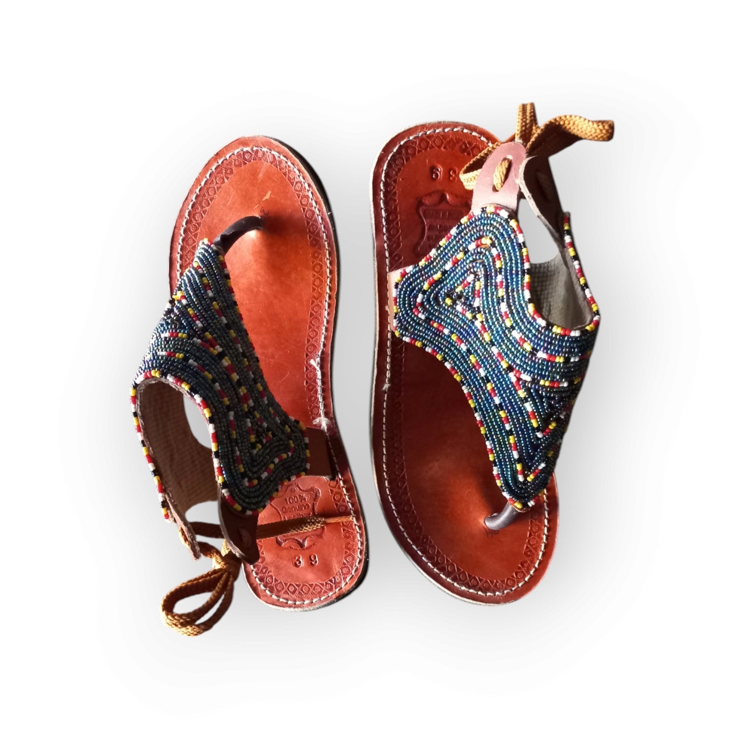 Handmade Maasai sandals with colorful beading and leather straps, made in Kenya.
