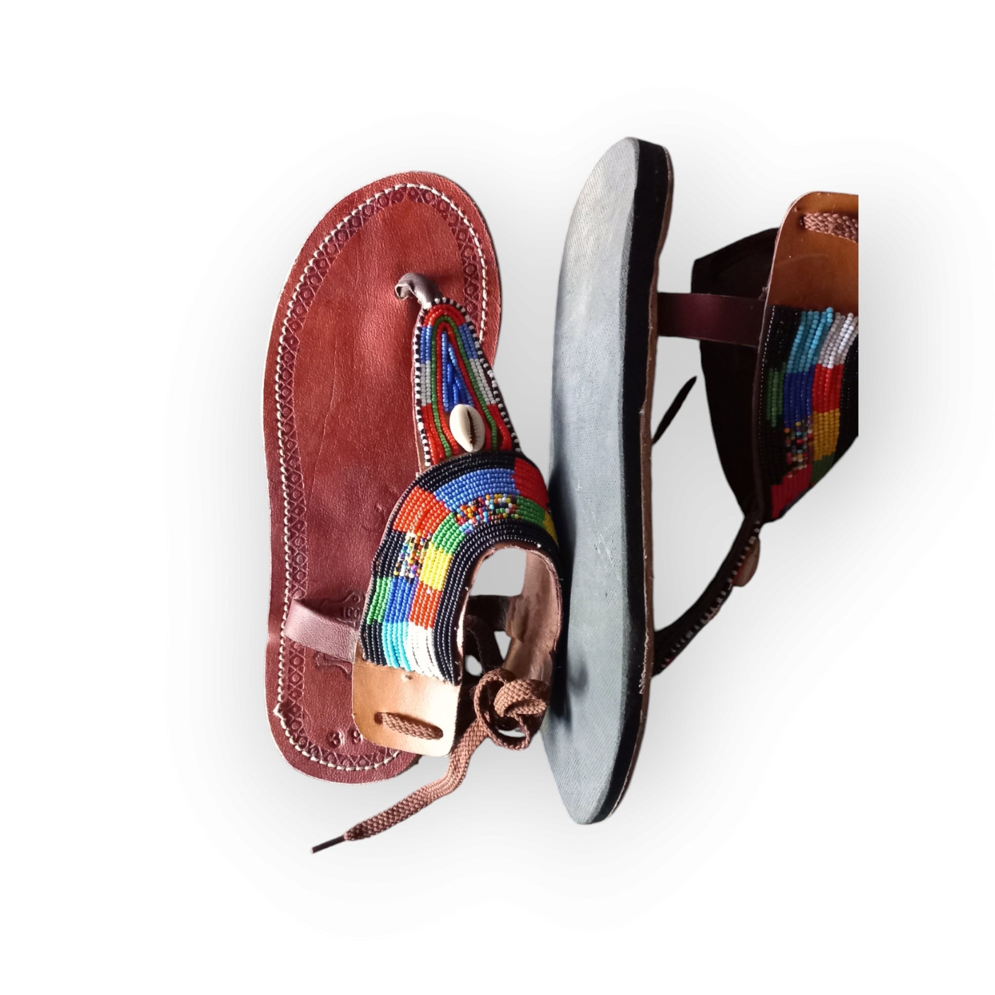 Handmade Maasai sandals with colorful beading and leather straps, made in Kenya.
