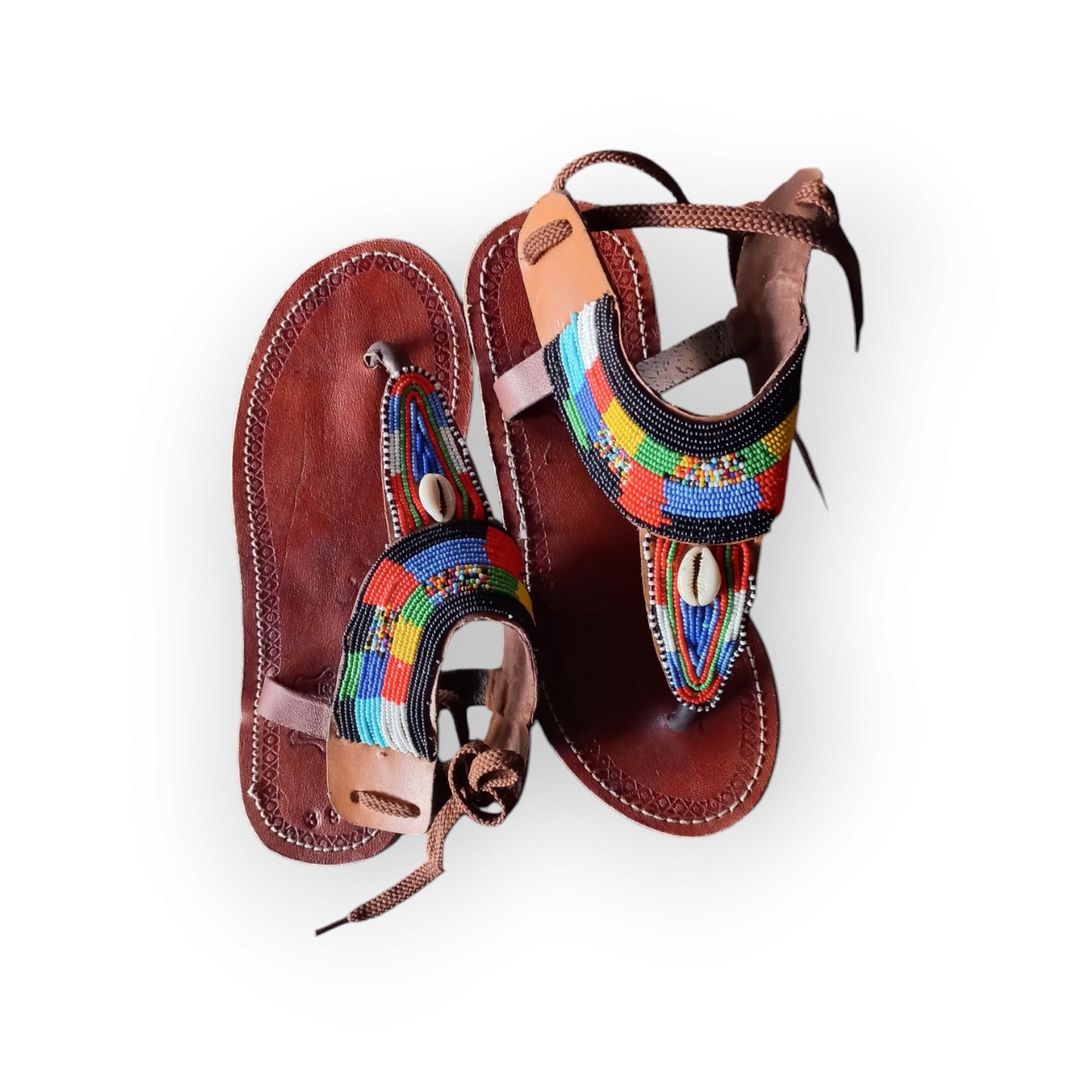 Handmade Maasai sandals with colorful beading and leather straps, made in Kenya.
