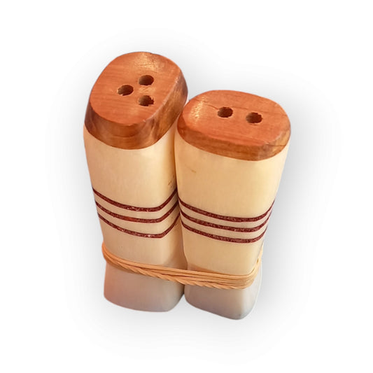Kenyan handcrafted cow bone salt and pepper shakers set with minimalist horizontal stripe design.