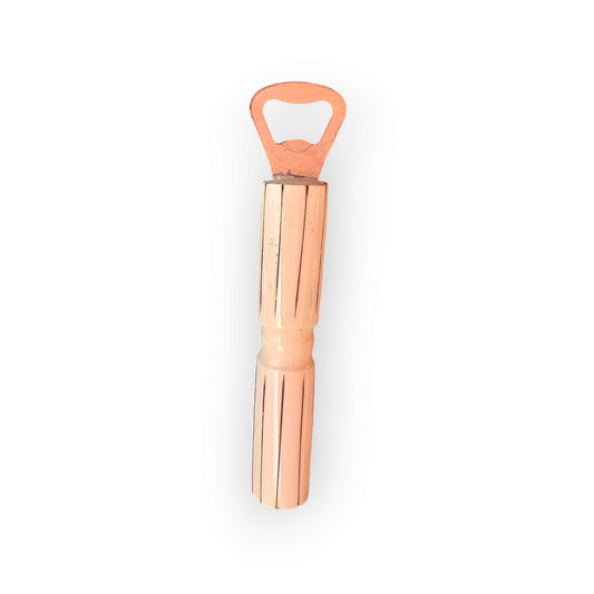 Kenyan handcrafted cow bone bottle opener with elegant fluted design