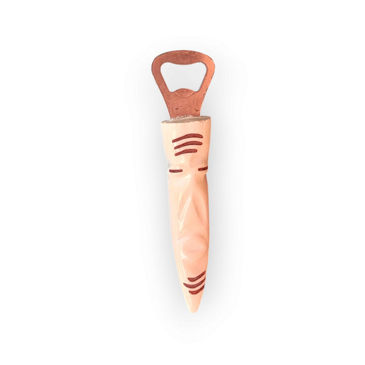 Kenyan handcrafted cow bone bottle opener with unique sculpted organic design.